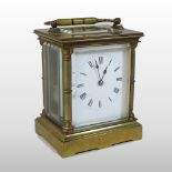 A 19th century French brass cased carriage clock, the white enamel dial with Roman hours,