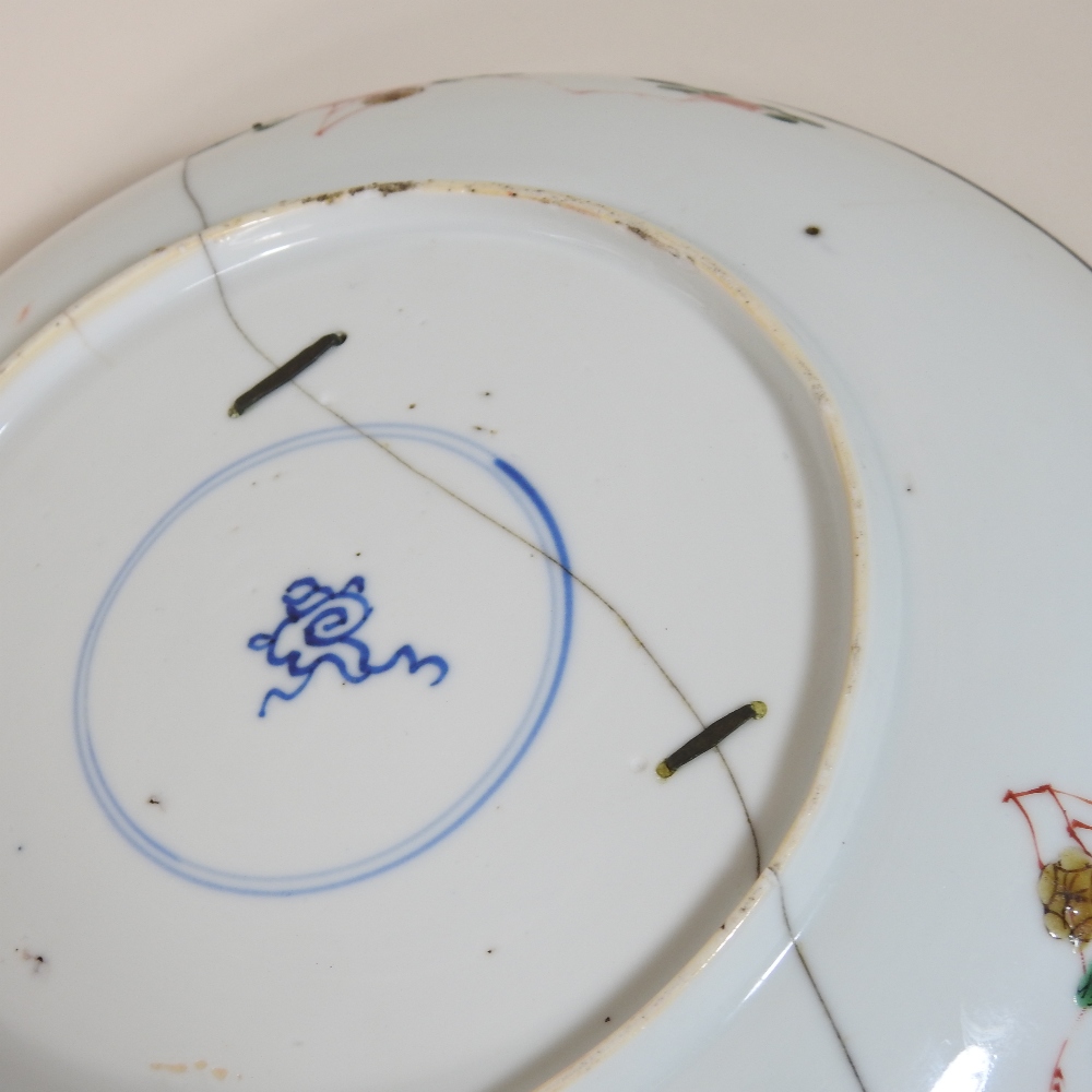 An 18th century Japanese blue glazed dish, reserved with floral panels, on a mottled blue ground, - Image 7 of 8