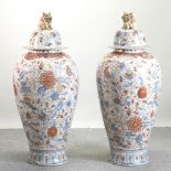 A pair of unusually large Imari porcelain ginger jars and covers,