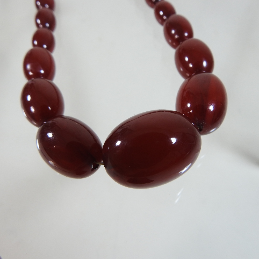 A cherry amber bead necklace, - Image 4 of 8