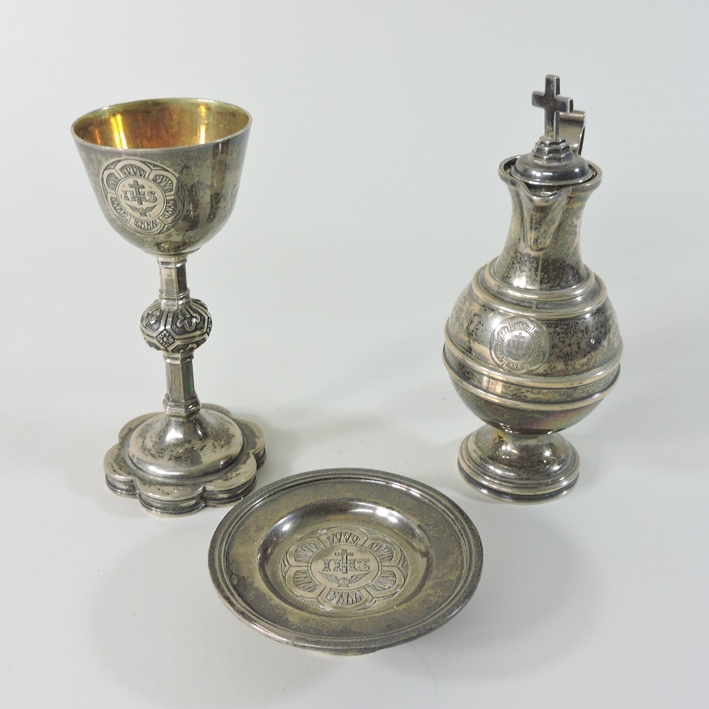 A Victorian silver travelling communion set, with engraved decoration, comprising a chalice,