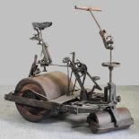 A highly unusual early 20th century iron pedal powered cricket crease roller,