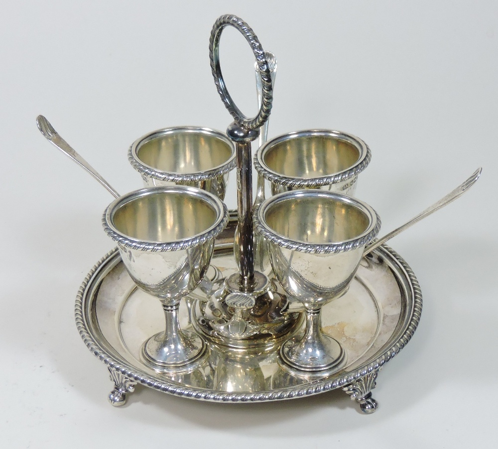 A Victorian silver egg cruet, of circular shape, fitted with four egg cups and four silver spoons, - Image 4 of 11