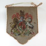 A 19th century beadwork banner, bearing a coat of arms,