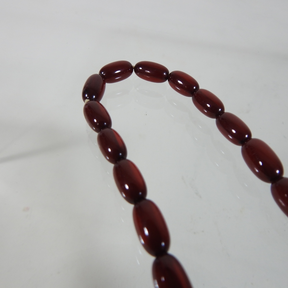 A cherry amber bead necklace, - Image 2 of 8