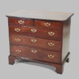 A George III mahogany chest, containing two short, over three long drawers, on bracket feet,