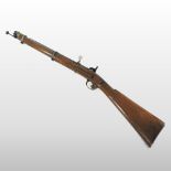 A 19th century percussion rifle, the walnut stock stamped 1741, having a steel ram rod,