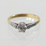 An early 20th century 18 carat gold solitaire diamond ring, approximately 0.