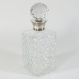 A cut glass decanter and stopper, of square shape, with a silver collar, London 1973,