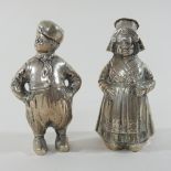 A pair of early 20th century Dutch figural peppers, modelled as a couple,