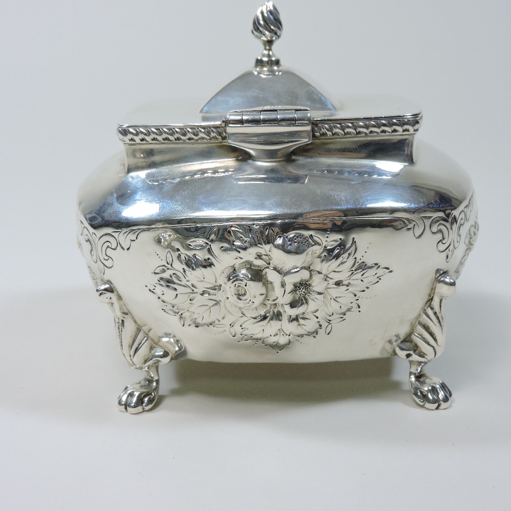 An early 20th century silver tea caddy, relief decorated with flowers, on paw feet, - Image 8 of 9