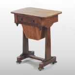 A 19th century rosewood ladies work table, with a hinged lid, on a platform base,