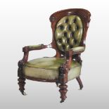 A Victorian green leather upholstered armchair, with a buttoned back,