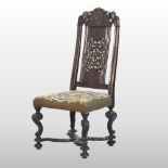 An 18th century continental carved walnut high back side chair,