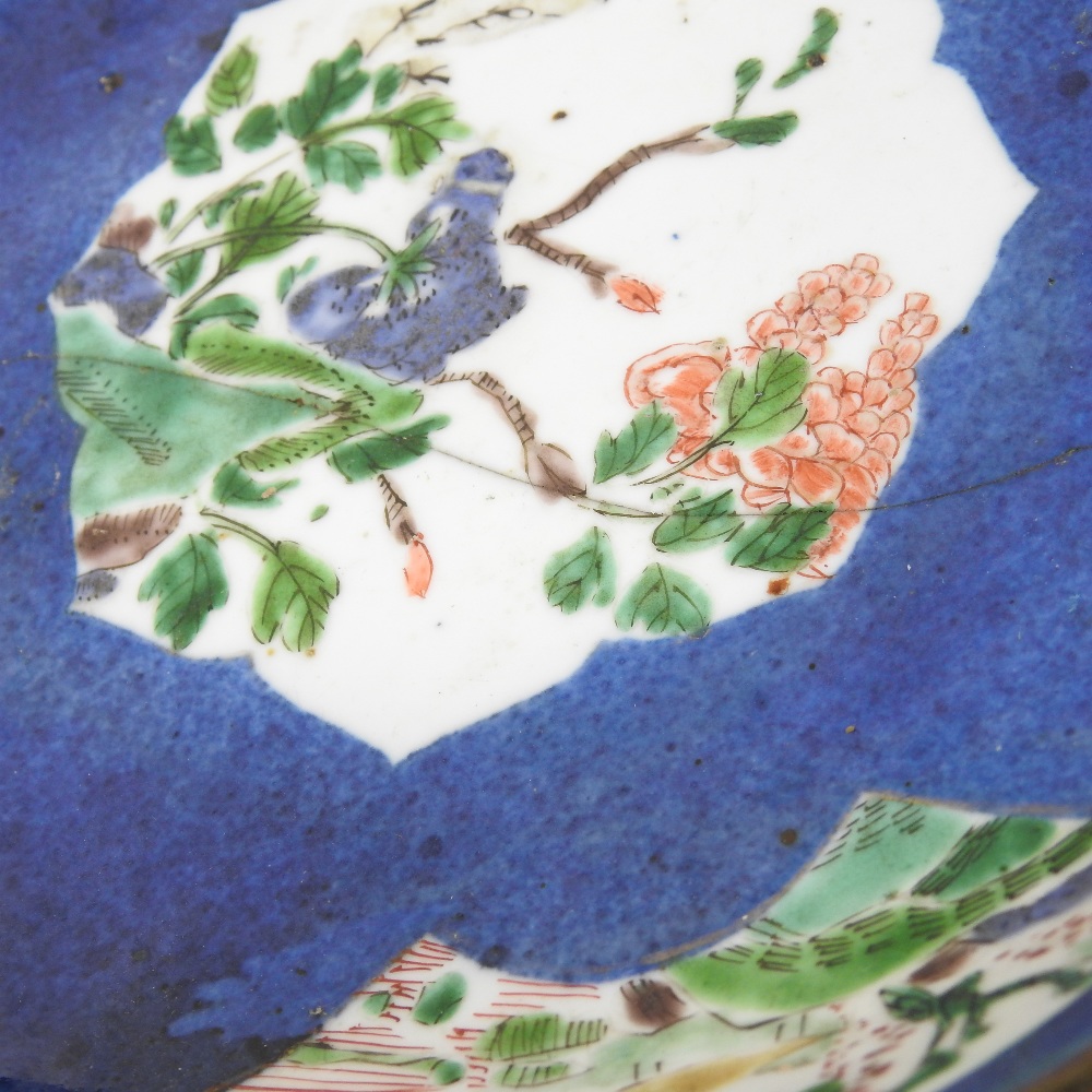An 18th century Japanese blue glazed dish, reserved with floral panels, on a mottled blue ground, - Image 2 of 8