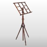 A 19th century Wheeldon patent turned walnut music stand, with an adjustable top,