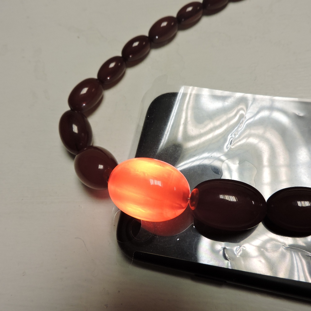 A cherry amber bead necklace, - Image 7 of 8