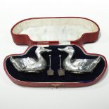 A pair of Edwardian novelty silver salts, each in the form of a duck,