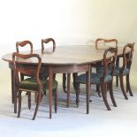 A George III mahogany D end dining table, with three additional leaves, 272 x 136cm,