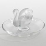 A Lalique frosted glass pin tray, in the form of a swan, on a dished base,