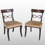 A pair of Regency mahogany side chairs, on sabre legs,