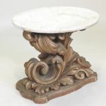 An ornate 19th century gilt occasional table, with a circular white marble top and scrolled base,