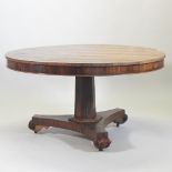 A George III rosewood and inlaid breakfast table, with a hinged circular top,