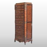 An early 20th century French parquetry narrow chest,