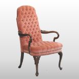 A pink upholstered button back armchair, of Queen Anne style,