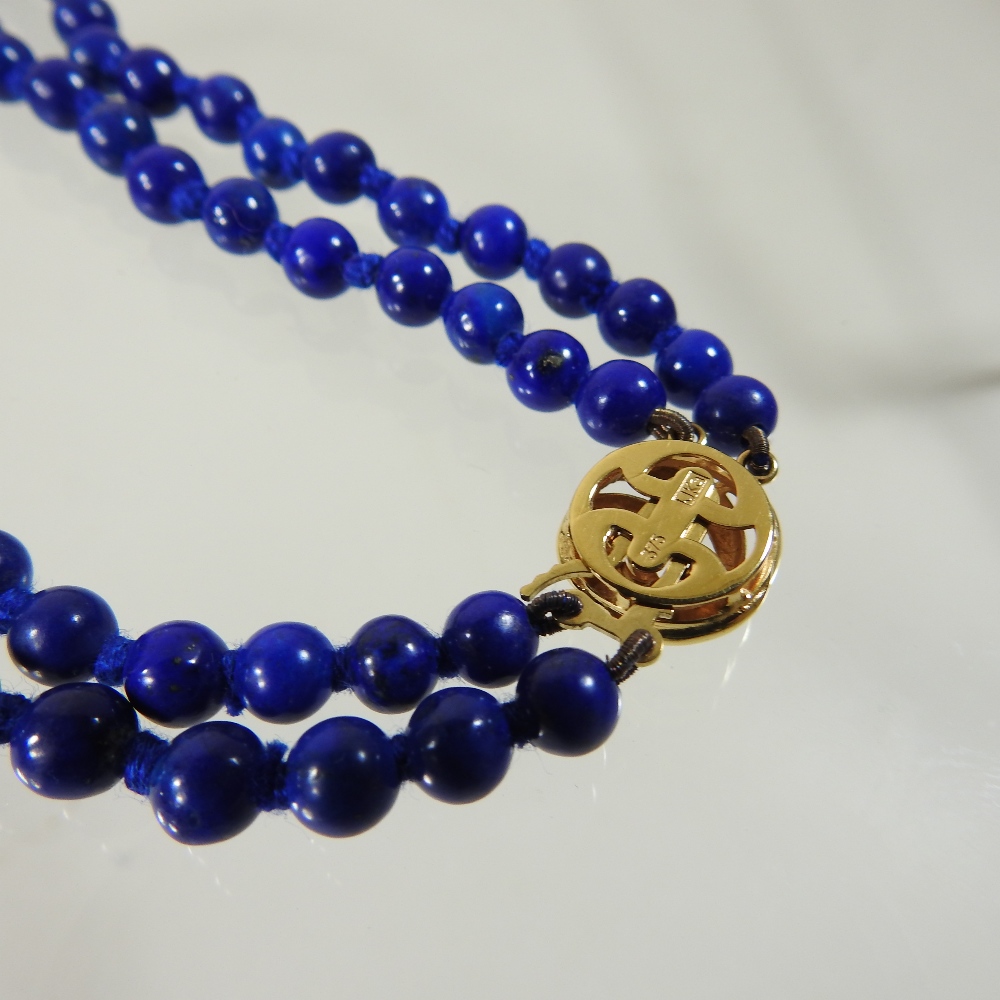 A lapis lazuli double strand bead necklace, with a 9 carat gold clasp, - Image 4 of 5