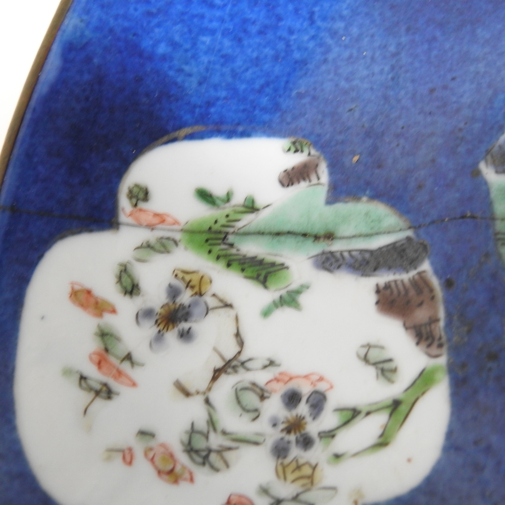 An 18th century Japanese blue glazed dish, reserved with floral panels, on a mottled blue ground, - Image 8 of 8