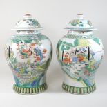 A pair of Chinese famille verte porcelain ginger jars and covers,