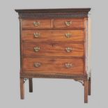A George III style chest, containing two short over three long graduated drawers, on a later stand,