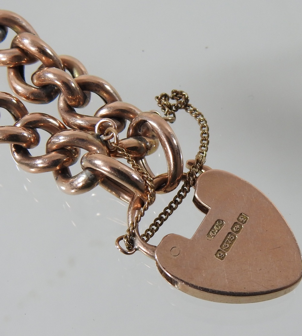 An early 20th century curb link bracelet, with a 9 carat gold padlock shaped clasp, - Image 2 of 3