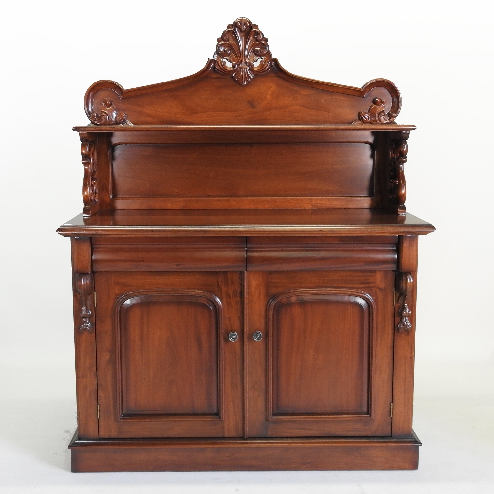A Victorian style mahogany chiffonier, with a carved gallery back,