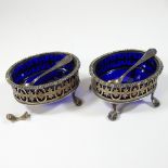A pair of early 20th century silver open salts, each of pierced oval shape,