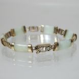 A 9 carat gold mounted jade coloured hardstone bracelet