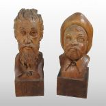 A mid 20th century Swiss carved softwood head of a man, on a plinth base,