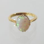 An 18 carat gold opal single stone ring,