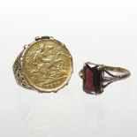A 9 carat gold ring, set with a half sovereign dated 1909,