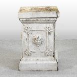 A 19th century cream painted cast iron garden pedestal, of square shape, with relief decoration,