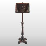 A Regency rosewood adjustable music stand, with a lyre shaped stand, on a reeded column,