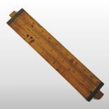 + An early 20th century Cary's brass mounted wooden cattle gauge, 20cm.