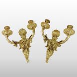 A pair of ornate Rococo style ormolu wall scones, each having two branches,