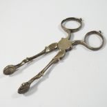 A pair of 19th century silver sugar tongs, with shell shaped terminals, marks indistinct,