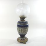 A 19th century Doulton Lambeth patent stoneware oil lamp,