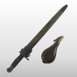 An early 20th century American bayonet, stamped US 1917, in a leather clad scabbard, 58cm long,