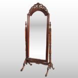 A Victorian style mahogany cheval mirror, with a fret carved pediment,