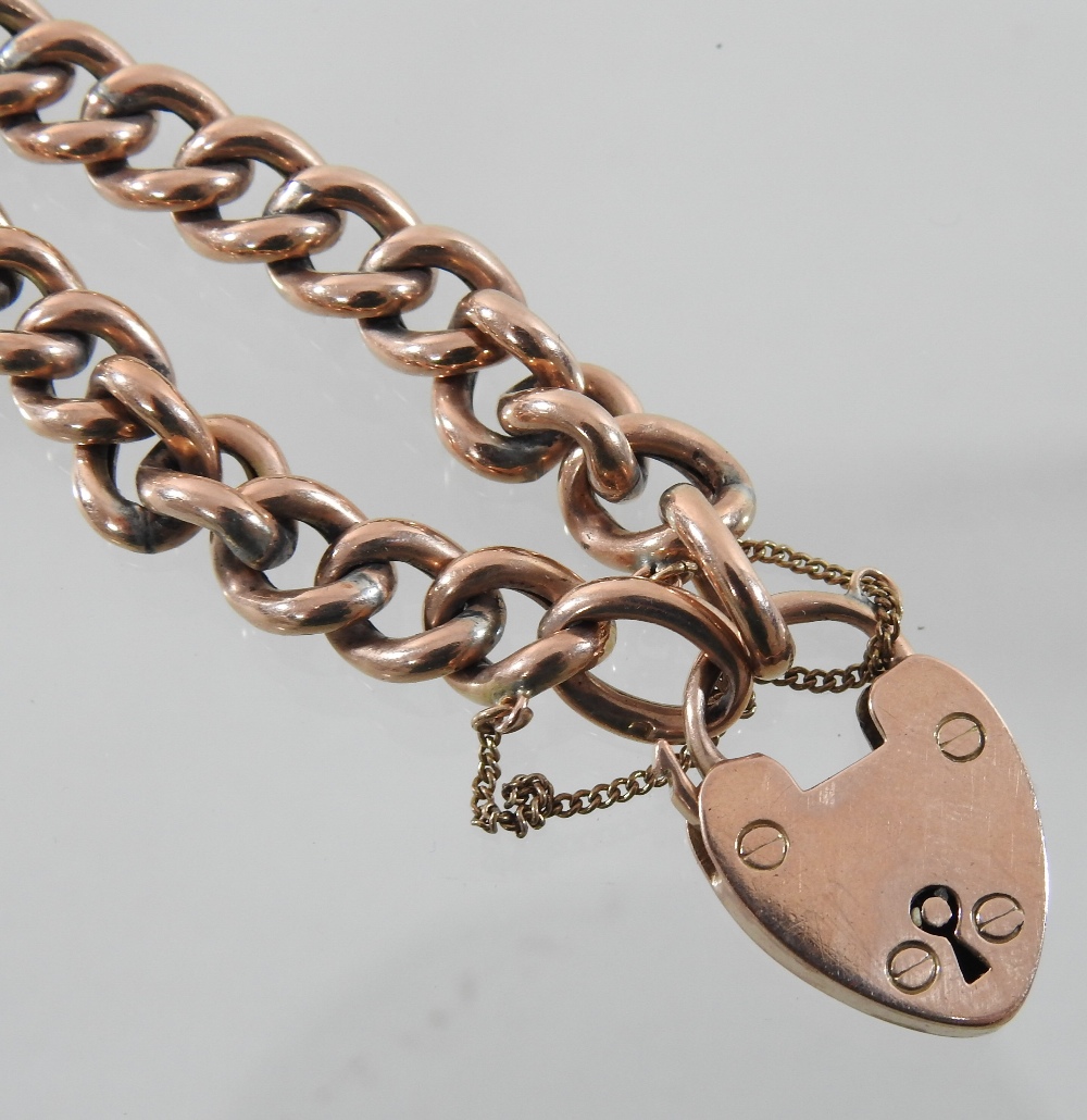 An early 20th century curb link bracelet, with a 9 carat gold padlock shaped clasp, - Image 3 of 3
