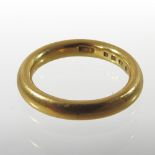 A 22 carat gold wedding band,